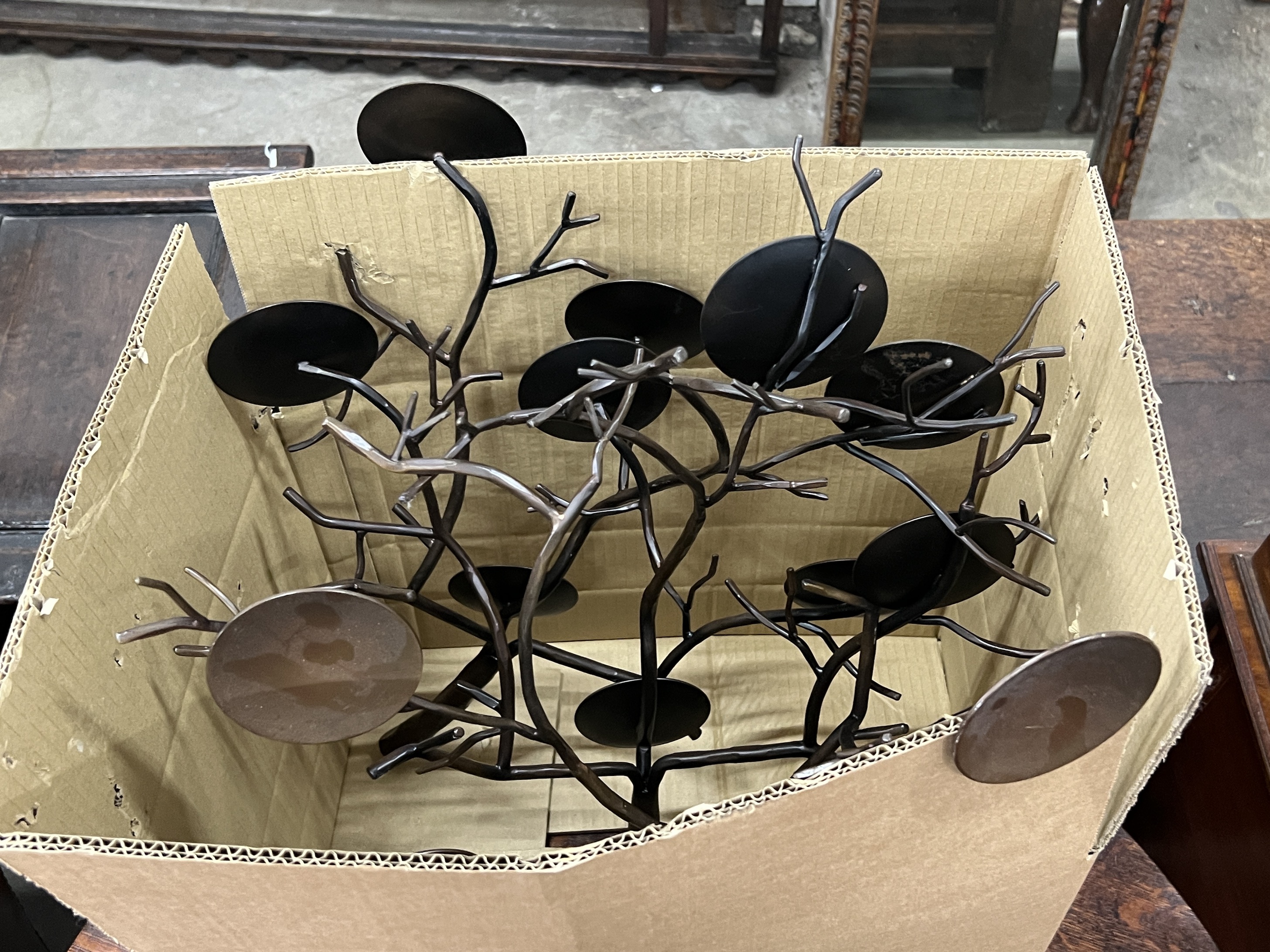 A set of four contemporary metal naturalistic five branch candle holders, length 60cm, height 20cm